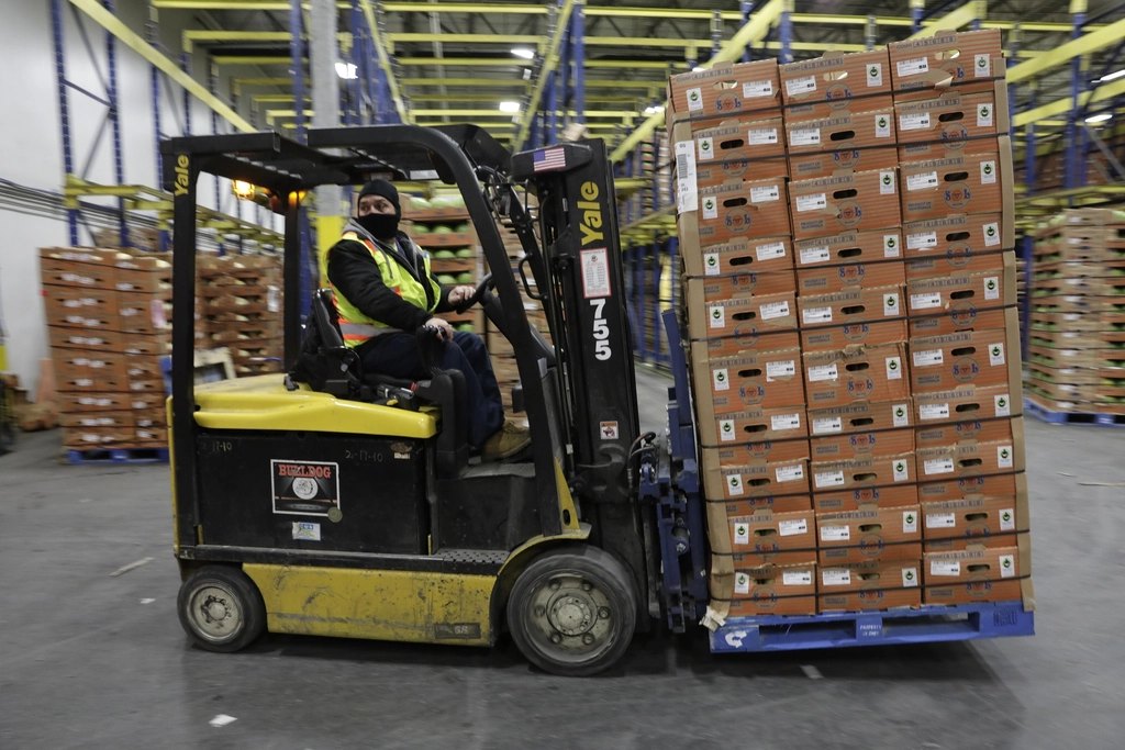 forklift operator shuttles pallet loaded